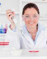 Portrait of a redhead scientist preparing a sample