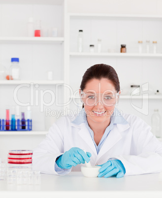 Smiling scientist preparing an experimentaion