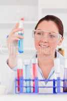 Portrait of a young scientist storing a test tube