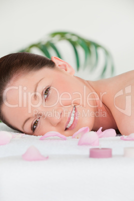 Portrait of a young woman lying on a massage table