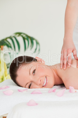 Portrait of a woman receiving a massage in a spa