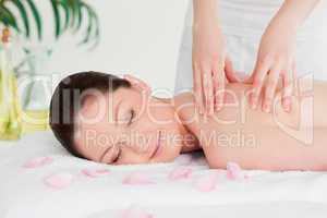 Cute woman closing her eyes during a massage