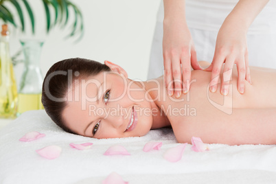 Redhead having a massage in a spa