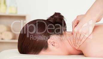 Red-haired woman having a back massage