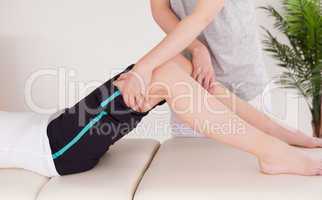 Young woman having a leg massage