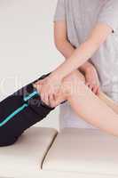 Athletic woman having a leg massage