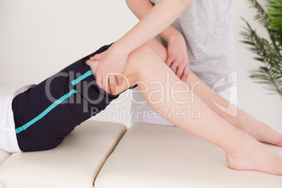 Sportswoman having a leg massage