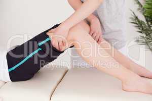 Sportswoman having a leg massage