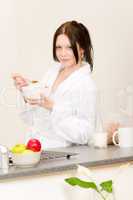 Young student girl eat cereal in kitchen