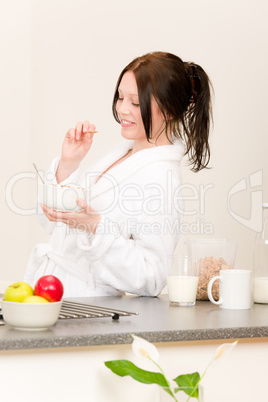 Young student girl eat cereal in kitchen