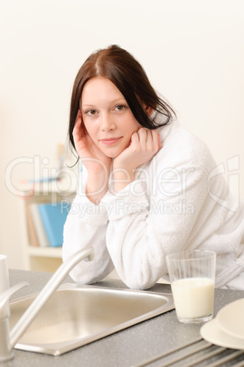 Young student girl with glass of milk