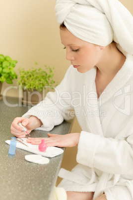 Young student girl polishing her nails