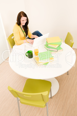 Young student girl home study with laptop
