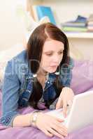 Young student girl home study with laptop