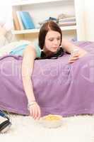 Young student girl on bed hold phone