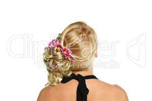 Model with luxuriant hair and a flower in her hair