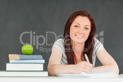 Cute student taking notes