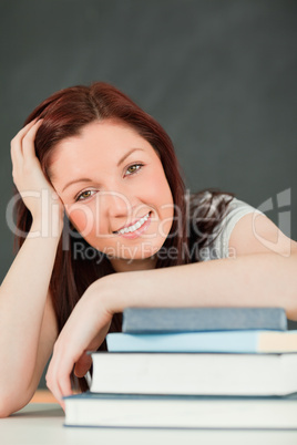 Portrait of a smiling young student with her the forearm on her