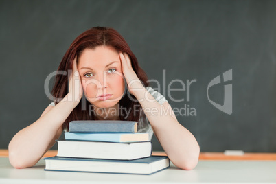 Tired young student in a classroom