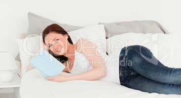 Attractive woman posing with a book