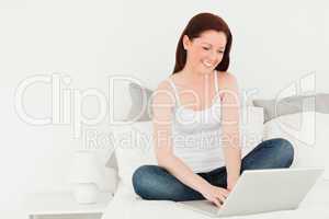 Good looking woman relaxing with her laptop