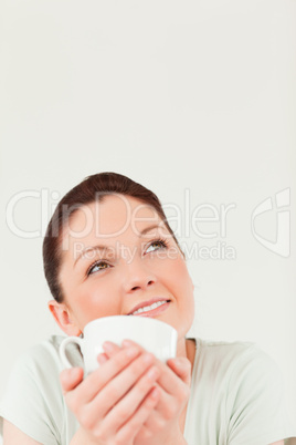 Attractive female posing while holding a bowl