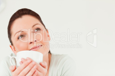 Good looking female posing while holding a bowl