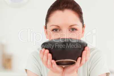 Attractive woman posing while holding a bowl