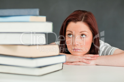 Desperate student looking at her books