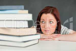 Desperate student looking at her books