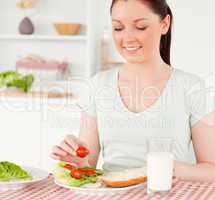 Charming woman ready to eat a sandwich for lunch