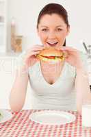 Portrait of a young woman having a sandwich