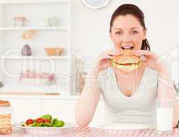 Cute woman eating a sandwich
