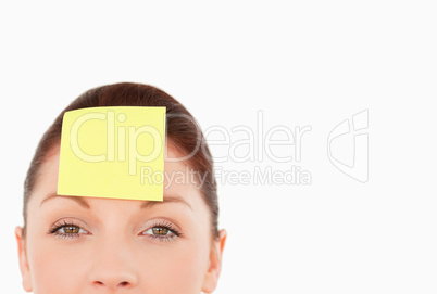 Young woman with a sign on her forehead