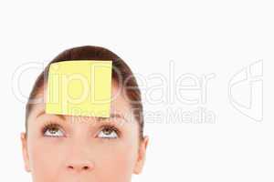 Cute woman with a sign on her forehead