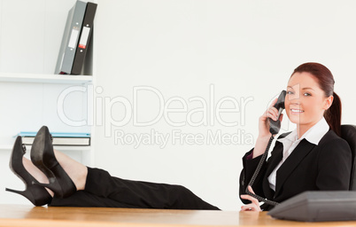 Smiling businesswoman on the phone