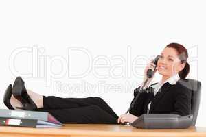 Beautiful businesswoman relaxing in her office