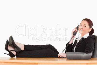 Good looking businesswoman on the phone in her office