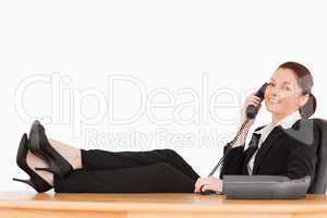 Good looking businesswoman on the phone in her office