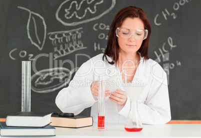 Beautiful scientist focusing on her experimentation