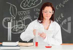 Beautiful scientist focusing on her experimentation