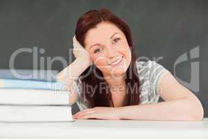 Close up of a young student with books