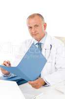 Mature doctor male hold document professional