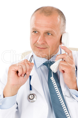 Mature doctor male on phone professional look