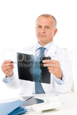 Mature senior doctor male hold x-ray