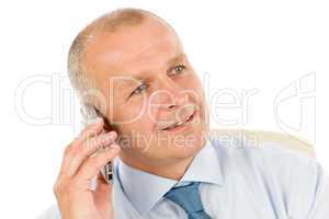 Smiling businessman on phone close-up portrait