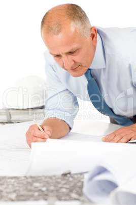 Senior man work on blueprints construction plans