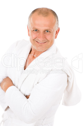 Male cosmetics - mature man in white bathrobe