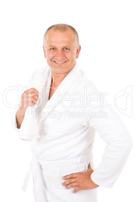 Male cosmetics - mature man in white bathrobe