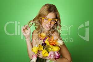 Happy Young Woman hugging a bouquet of tulips